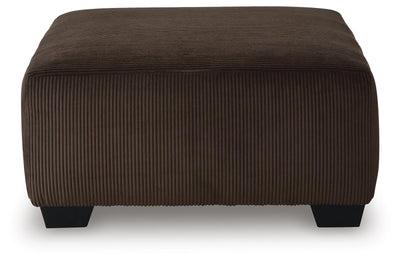 Kimlee 3-Piece Sectional and Ottoman in Chocolate