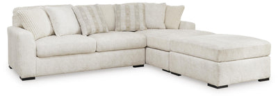 Chessington 2-Piece Sectional and Ottoman in Ivory