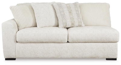 Chessington 2-Piece Sectional and Ottoman in Ivory